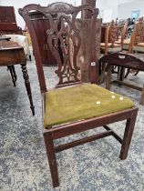 A GEORGIAN MAHOGANY SIDE CHAIR WITH CARVED PIERCED BACK TOGETHER WITH A WM. IV ARM CHAIR WITH REEDED