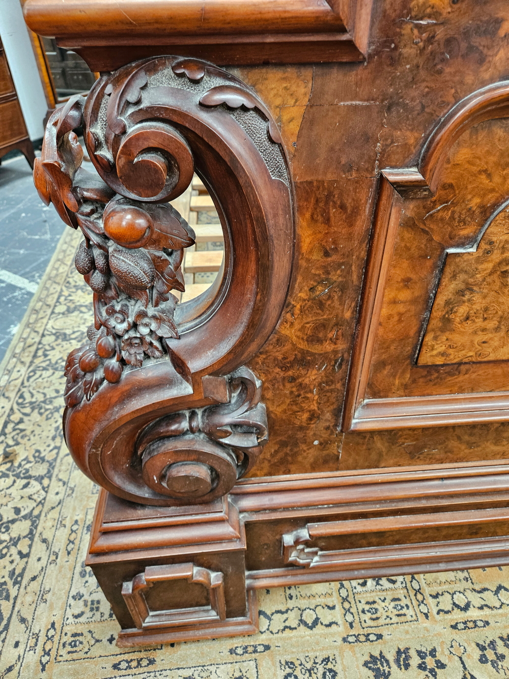 A LATE VICTORIAN BURR WALNUT DOUBLE BED WITH PANELLED ENDS FLANKED BY SCROLLING BRACKETS CARVED WITH - Image 5 of 8