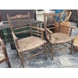 TWO WILLIAM MORRIS STYLE OAK ELBOW CHAIRS WITH RUSH SEATS