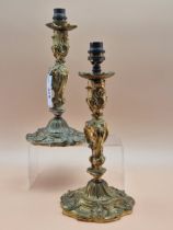 A PAIR OF ROCOCO ORMOLU CANDLESTICKS AS TABLE LAMPS. H 29cms.