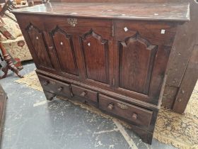 AN 18th C. OAK MULE CHEST WITH A FOUR PANELLED FRONT ABOVE THREE DRAWERS. W 143 x D 50 x H 111cms.