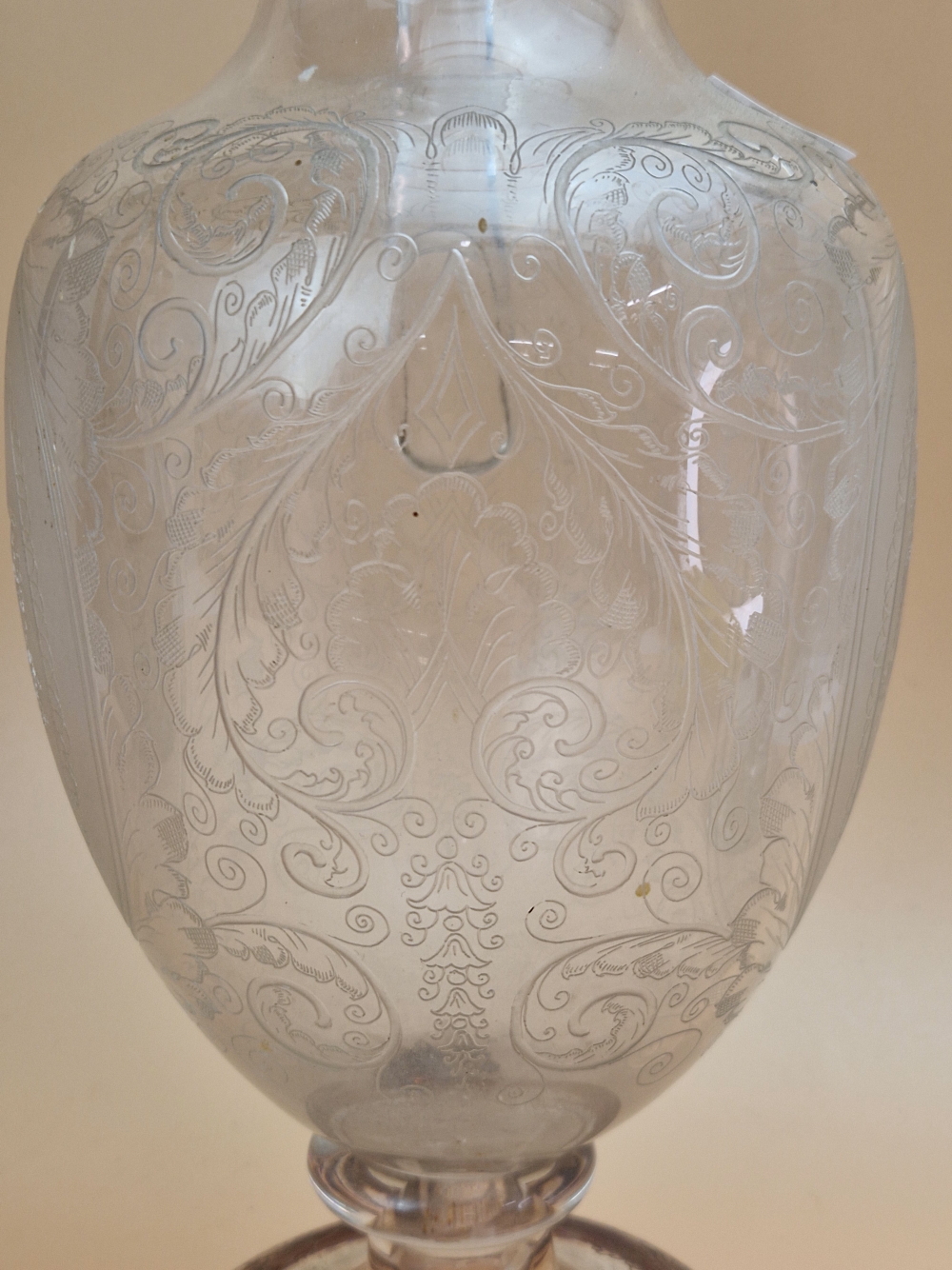 A CLEAR GLASS BALUSTER EWER ETCHED WITH CUPID OVALS AND WITH A CRANBERRY TRAILED RIM AND FOOT, A - Image 6 of 14