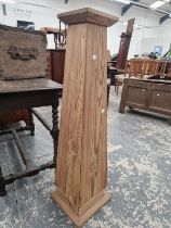 A PINE STAND OF SQUARE SECTIONED OBELISK SHAPE. H 106cms.