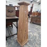 A PINE STAND OF SQUARE SECTIONED OBELISK SHAPE. H 106cms.