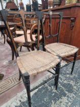 A PAIR OF VICTORIAN WALNUT INLAID EBONY SIDE CHAIRS WITH BASKET WORK SEATS