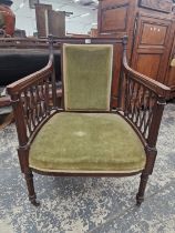 A REGENCY STYLE MAHOGANY DESK CHAIR, THE RECTANGULAR BACK SPLAT AND SEAT UPHOLSTERED IN GREEN
