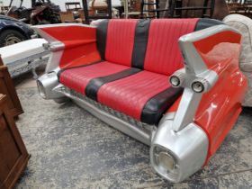 A MID CENTURY STYLE DINER SEAT FORMED AS THE TAIL END OF A CADILLAC