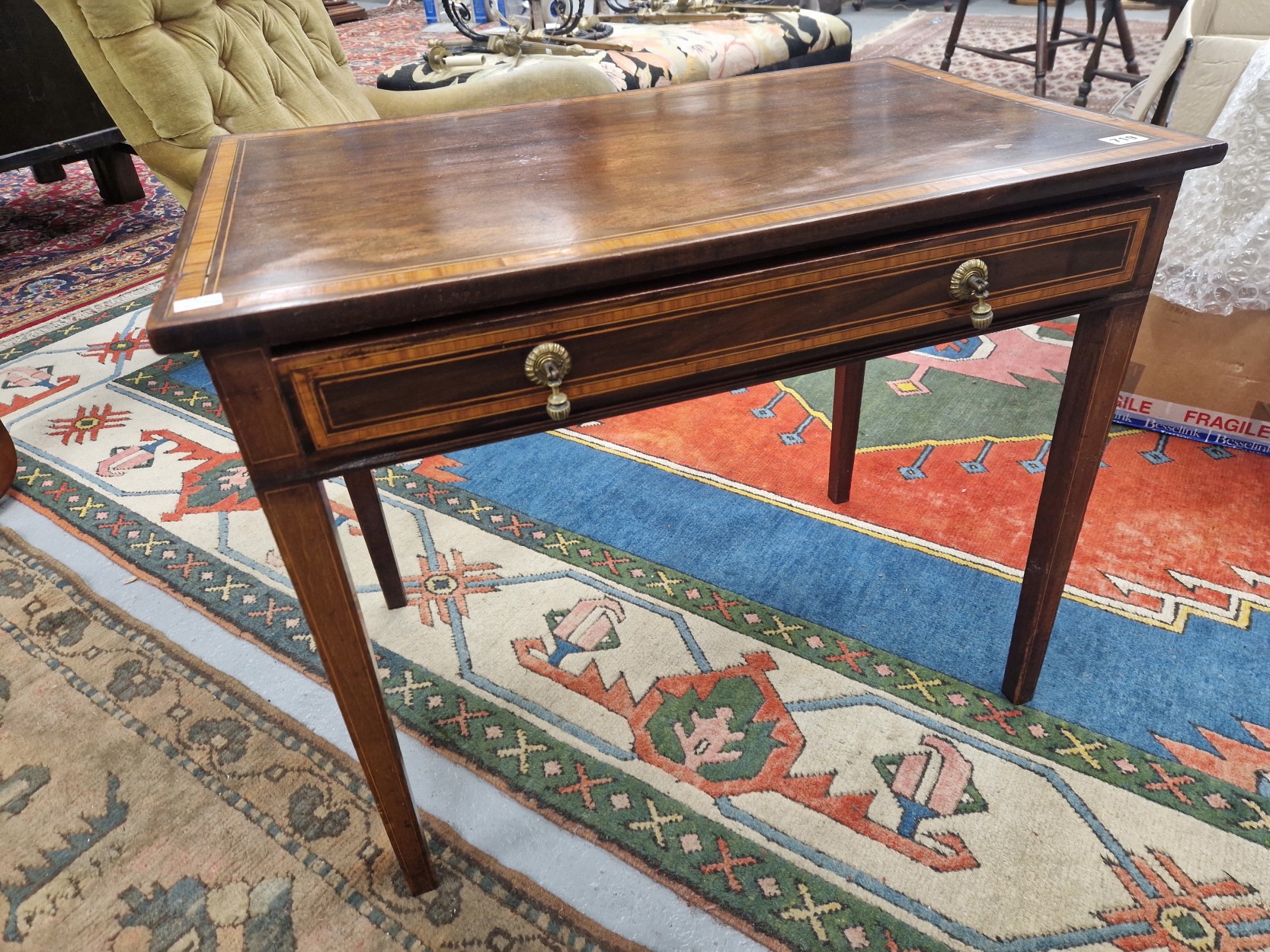 AN ANTIQUE SATIN WOOD BANDED MAHOGANY SIDE TABLE WITH A SINGLE DRAWER ABOVE THE LINE INLAID TAPERING