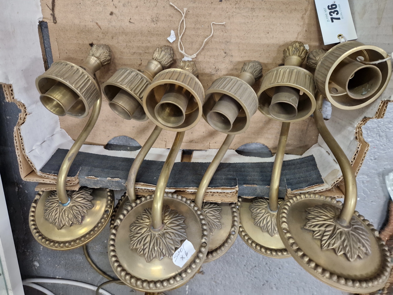 A SET OF SIX BRONZE WALL LIGHTS, AS RETAILED BY CHARLES EDWARDS, EACH WITH A SINGLE SOCKET ON AN ARM