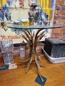 A PAIR OF GLASS TOPPED GILT METAL WHEAT SHEAF TABLES. Dia. 54 x H 53cms.