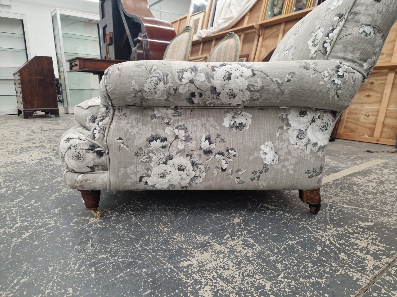 A HOWARD TYPE ARMCHAIR BY WILLIAM BIRCH UPHOLSTERED IN GREY FLORAL MATERIAL, ONE MAHOGANY BACK LEG - Image 2 of 6