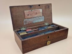 A LATE 19th C. REEVES MAHOGANY PAINT BOX CONTAINING SOME BLOCKS OF UNUSED PAINT AND CERAMIC PALETTES