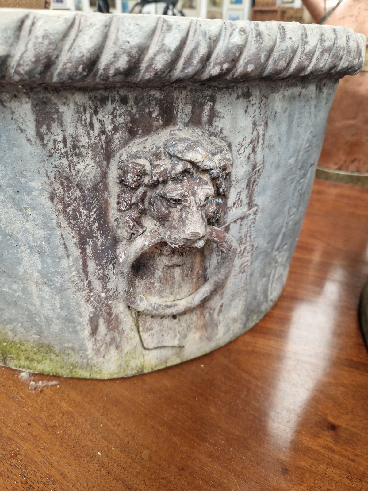 A PAIR OF 19th C. LEAD CYLINDRICAL PLANTERS WITH GADROONED RIMS ABOVE FOUR LION MASK AND RING - Image 3 of 4