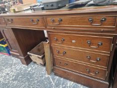 A mahogany single pedestal desk.