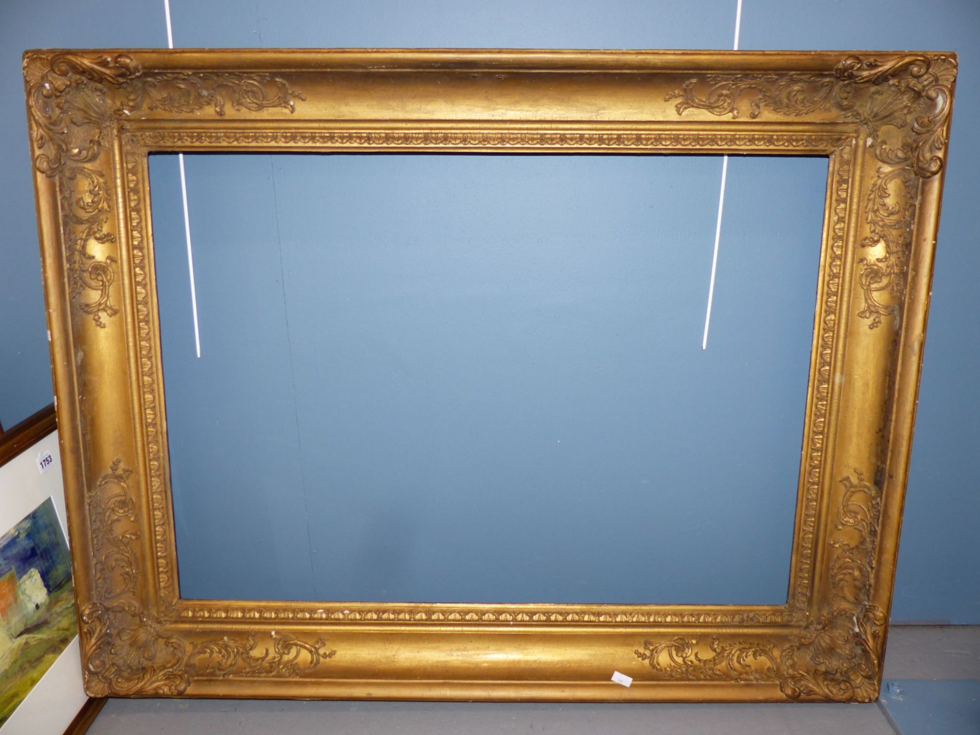 A LARGE 19TH CENTURY GILTWOOD AND GESSO PICTURE FRAME. - Image 2 of 2