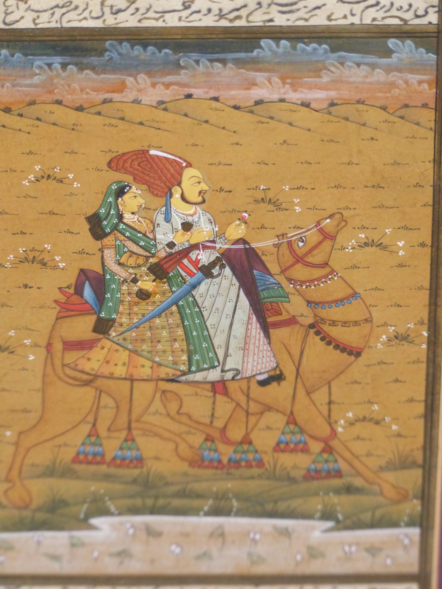 INDIAN MUGHAL SCHOOL, THREE MINIATURE GOUACHE PAINTINGS COMPRISING A LADY AND GENTLEMAN RIDING A
