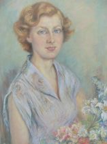 MOLLIE FORESTIER-WALKER (BRITISH 1912-1990), PORTRAIT OF JANET PHILLIPS WITH FLOWERS, SIGNED AND
