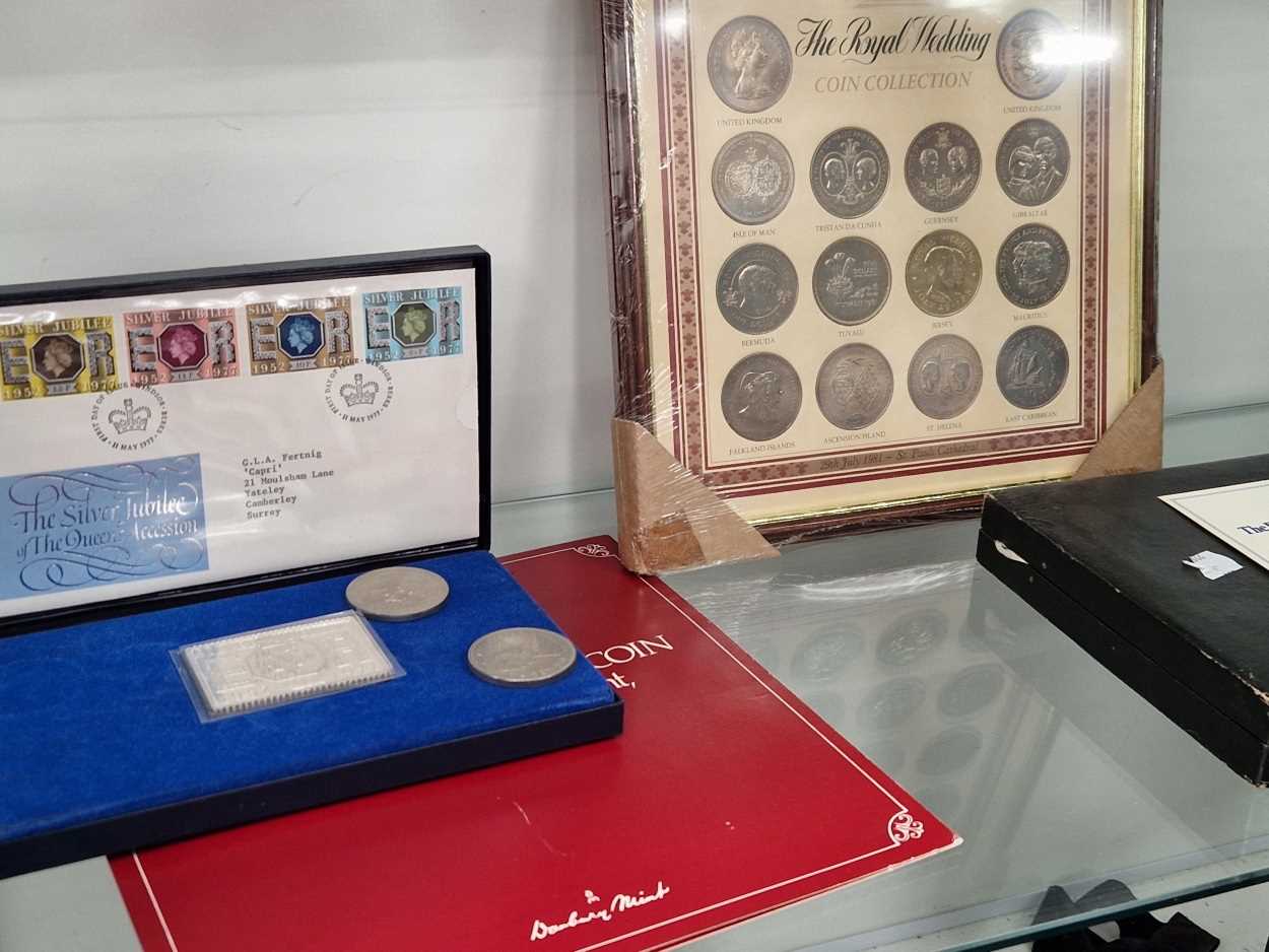 Cased commemorative coins and postage stamps