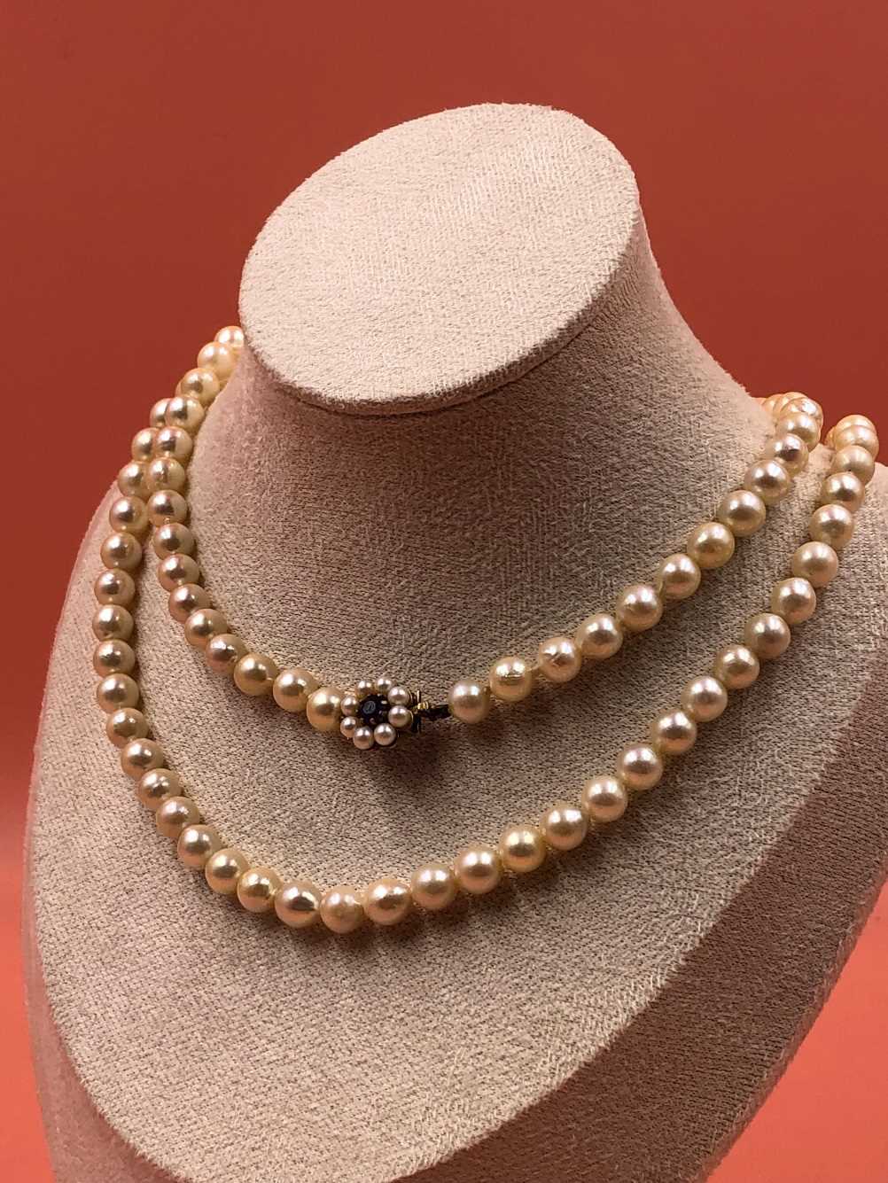 A opera length row of  slightly graduated cultured pearls complete with a 9ct gold stamped - Image 2 of 5