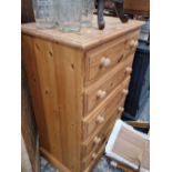 A pine five drawer chest.