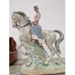 A Rex porcelain Lladro style porcelain figure of a lady riding side saddle