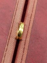 A 22ct hallmarked gold wedding ring. Weight 3.09grms.