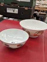 Two Chinese Wucai bowls, the exteriors with butterfly and flower roundels on one, dia 15cms, and
