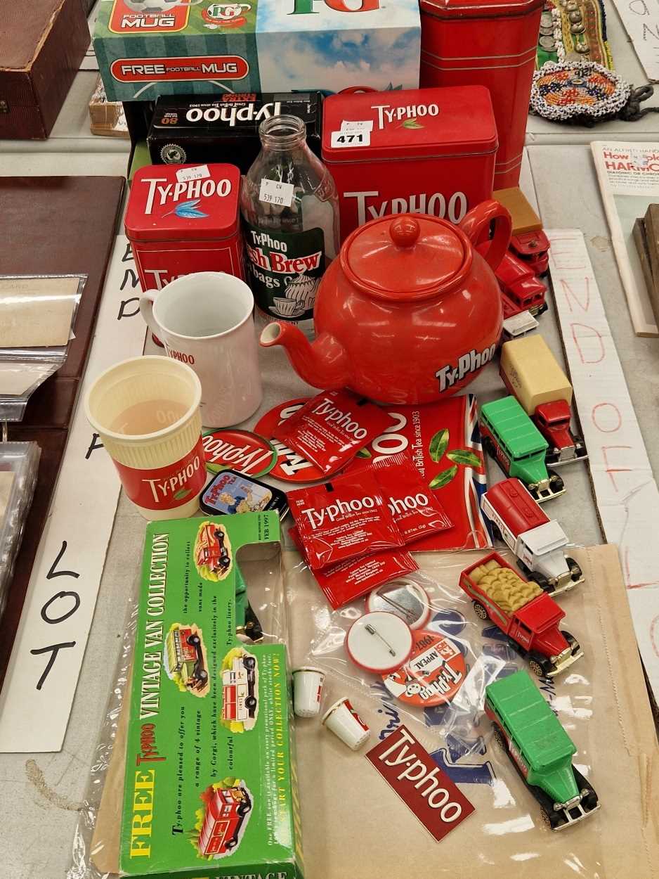 A collection of Typhoo tea memorabilia to include die cast toys, tins and mugs