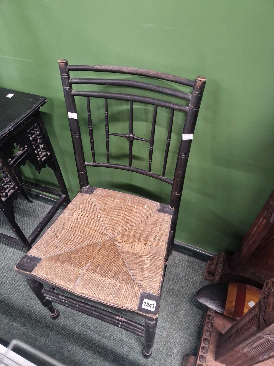 An ebonised side chair.