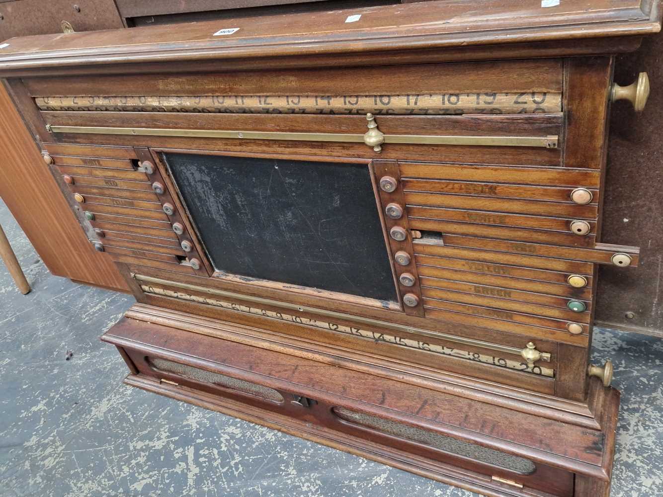 An antique snooker score board.