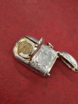 A large Victorian hallmarked silver combined vesta and sovereign case, by William Neale & Sons.