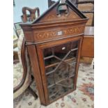 A mahogany inlaid glazed corner cabinet.