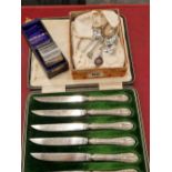 Hallmarked silver to include coffee spoons, a napkin ring, and a set of silver handles knives.