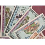 Four vintage Disney Dollar banknotes and various other world banknotes.
