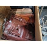 A quantity of vintage leather cases and handbags.