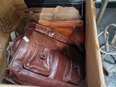 A quantity of vintage leather cases and handbags.