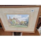 A watercolour of a cottage signed H. Gillett.