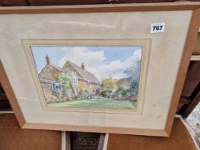 A watercolour of a cottage signed H. Gillett.