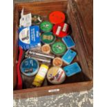 A wooden brief case containing tins of air gun ammunition