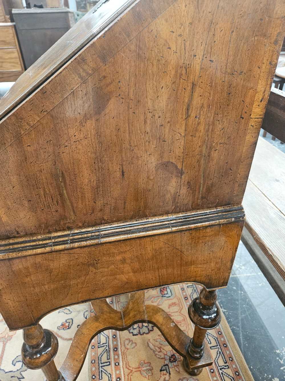 A 17th century style walnut bureau on stand. - Image 4 of 47