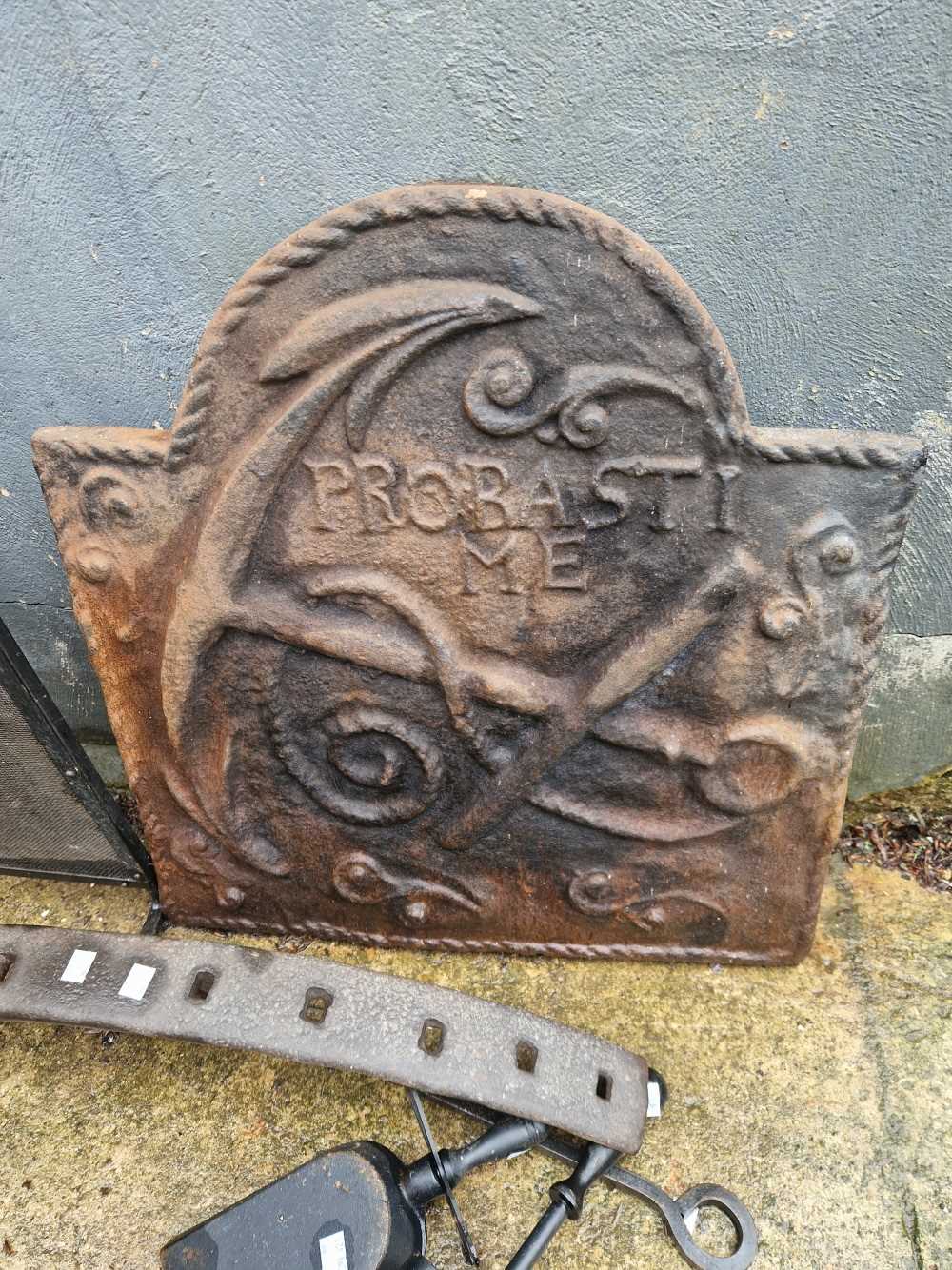 A small cast iron fire back etc