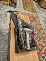 A saxaphone in leather carry case