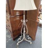 A wrought iron standard lamp.