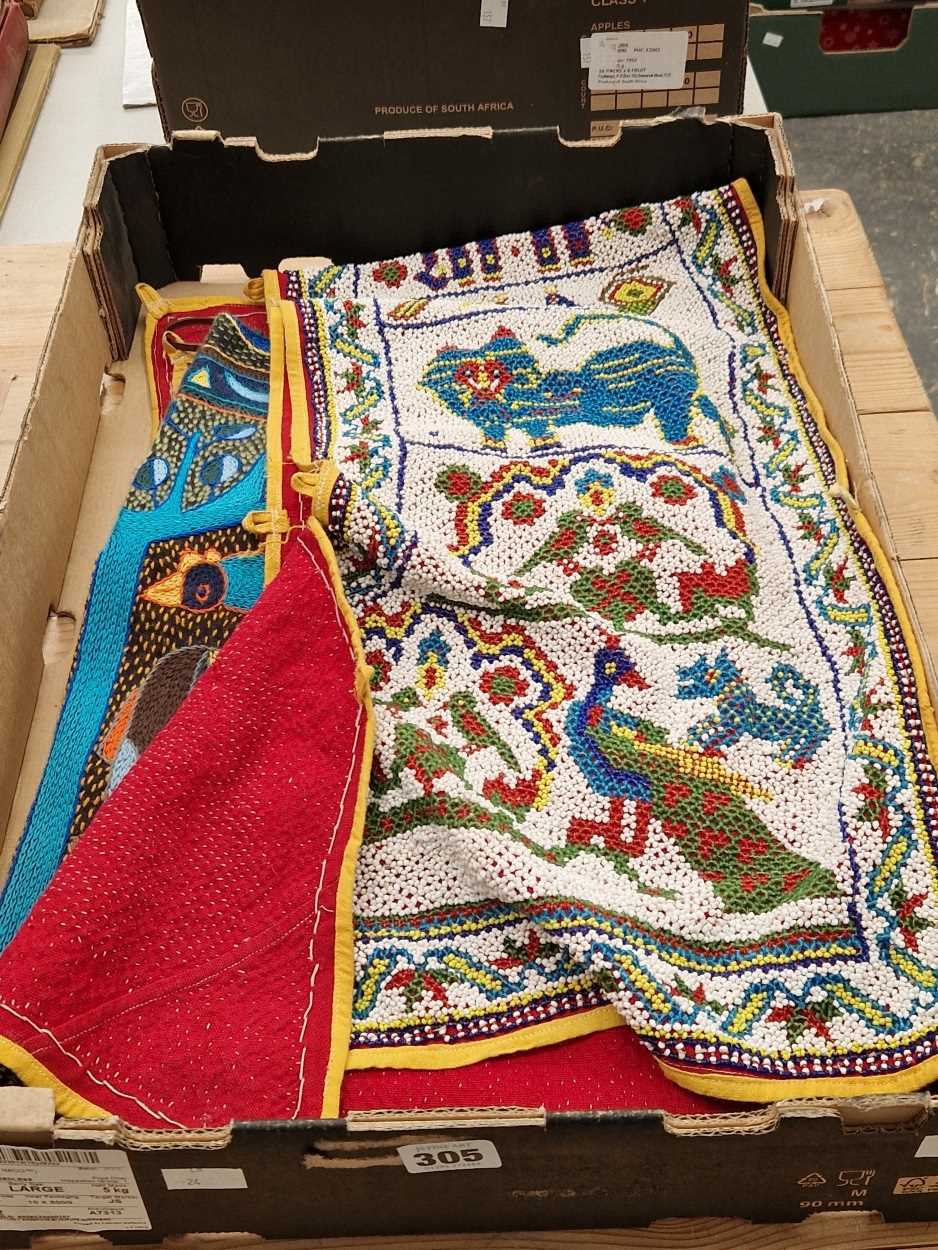 Two beadwork overmantel panels, Indian textiles with one sewn with mirrors together with a Kaross