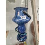 A Loetz type blue art glass vase entwined by a snake.