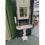 A console table with cherub support and mirror over.