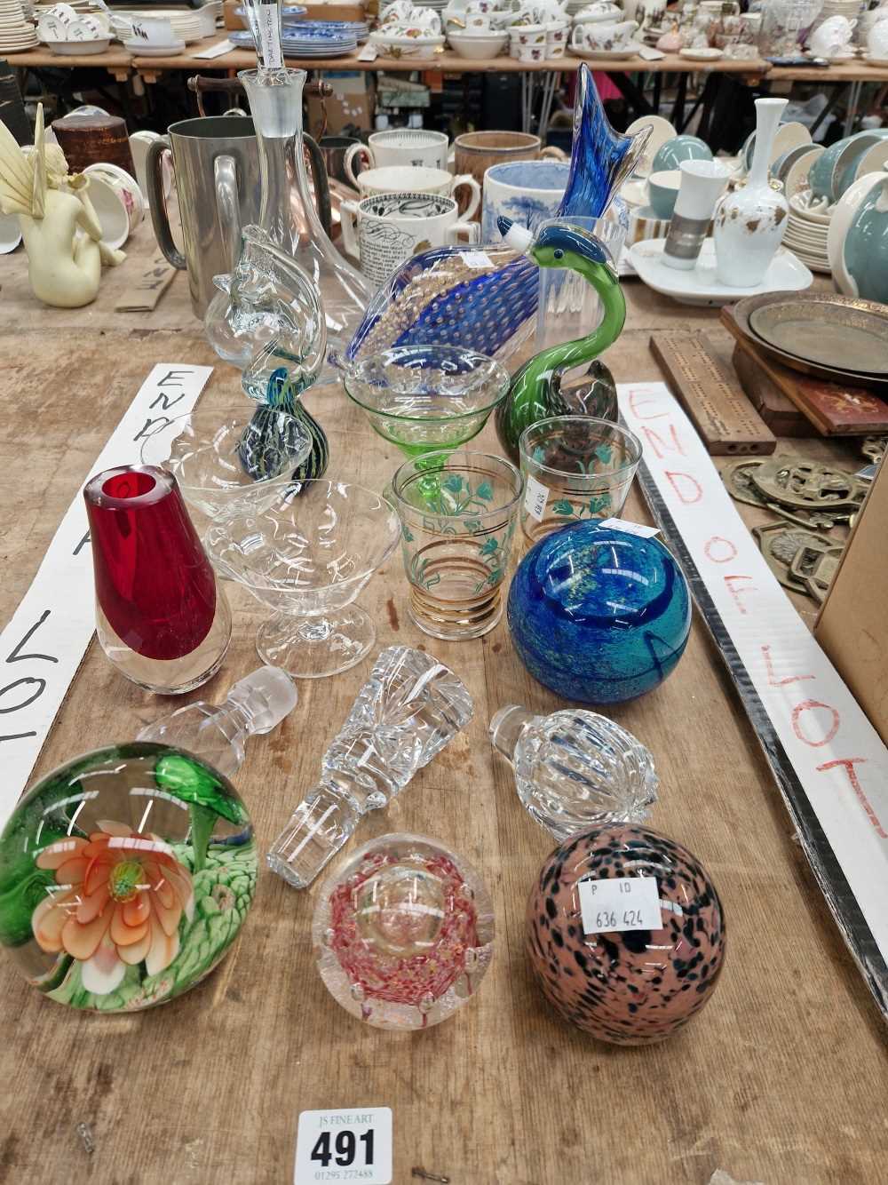 Glass paperweights, ornaments, vases and a decanter.