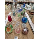 Glass paperweights, ornaments, vases and a decanter.