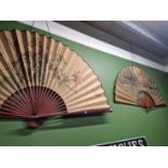 Two large Oriental fans.