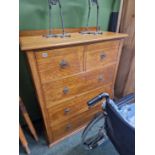 A Art Nouveau oak chest of deep drawers. H 125cm W 99cm D 46cm